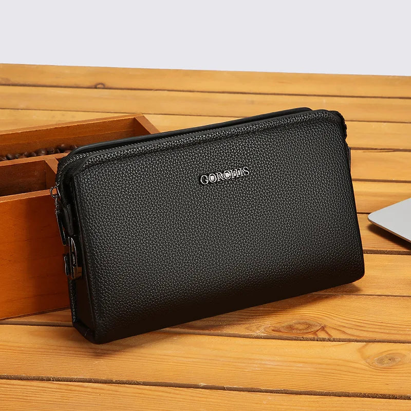 Men's Biometric Clutch Bag With Fingerprint Lock, Secure Anti-Theft Organizer in black PU leather-style finish on a wooden table